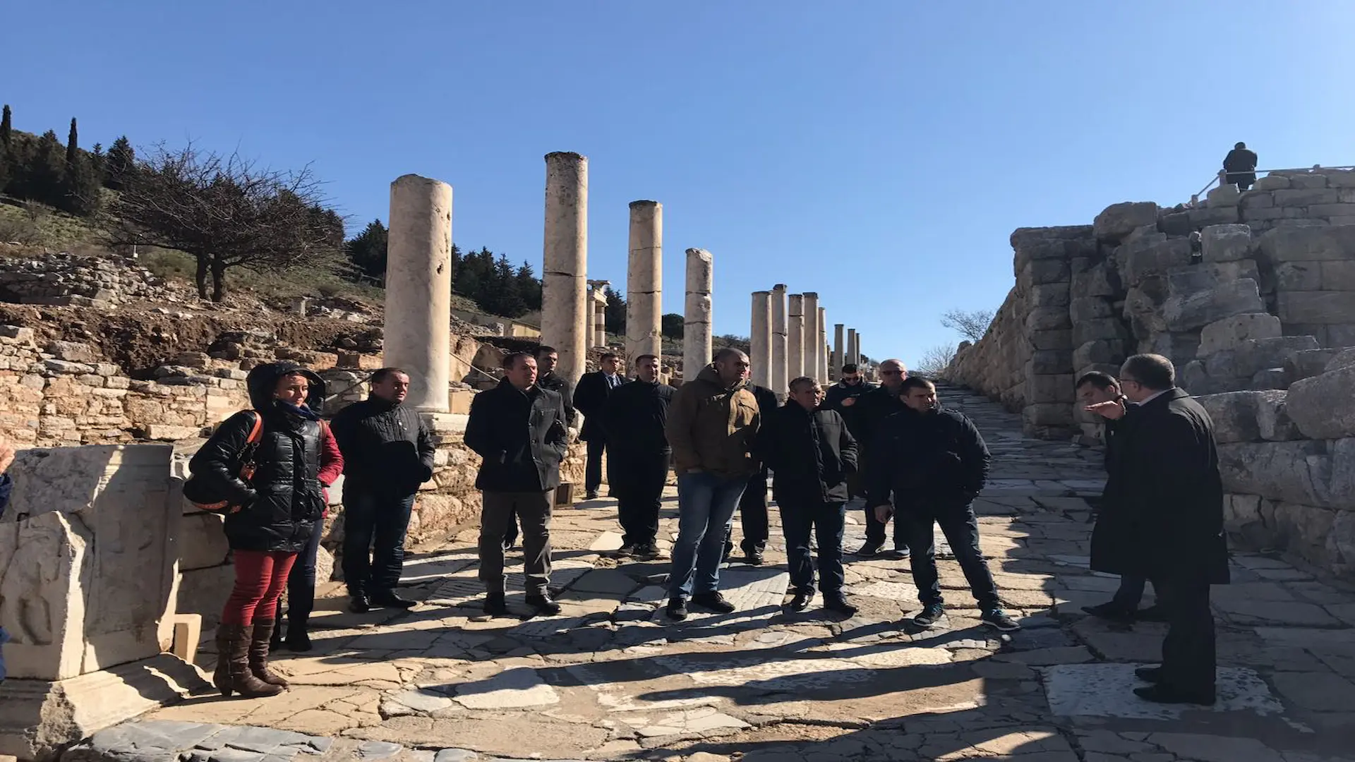 Private tour group walking through the column-lined Curetes Way in the heart of Ephesus.