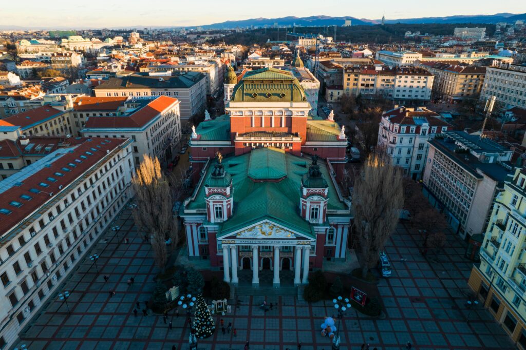 Stunning aerial view of Ivan Vazov National Theater and surrounding Sofia cityscape.